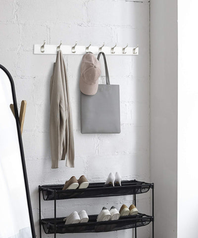 Amazon Basics 8-hook rack keeps hats, bags, and leashes within easy reach.
