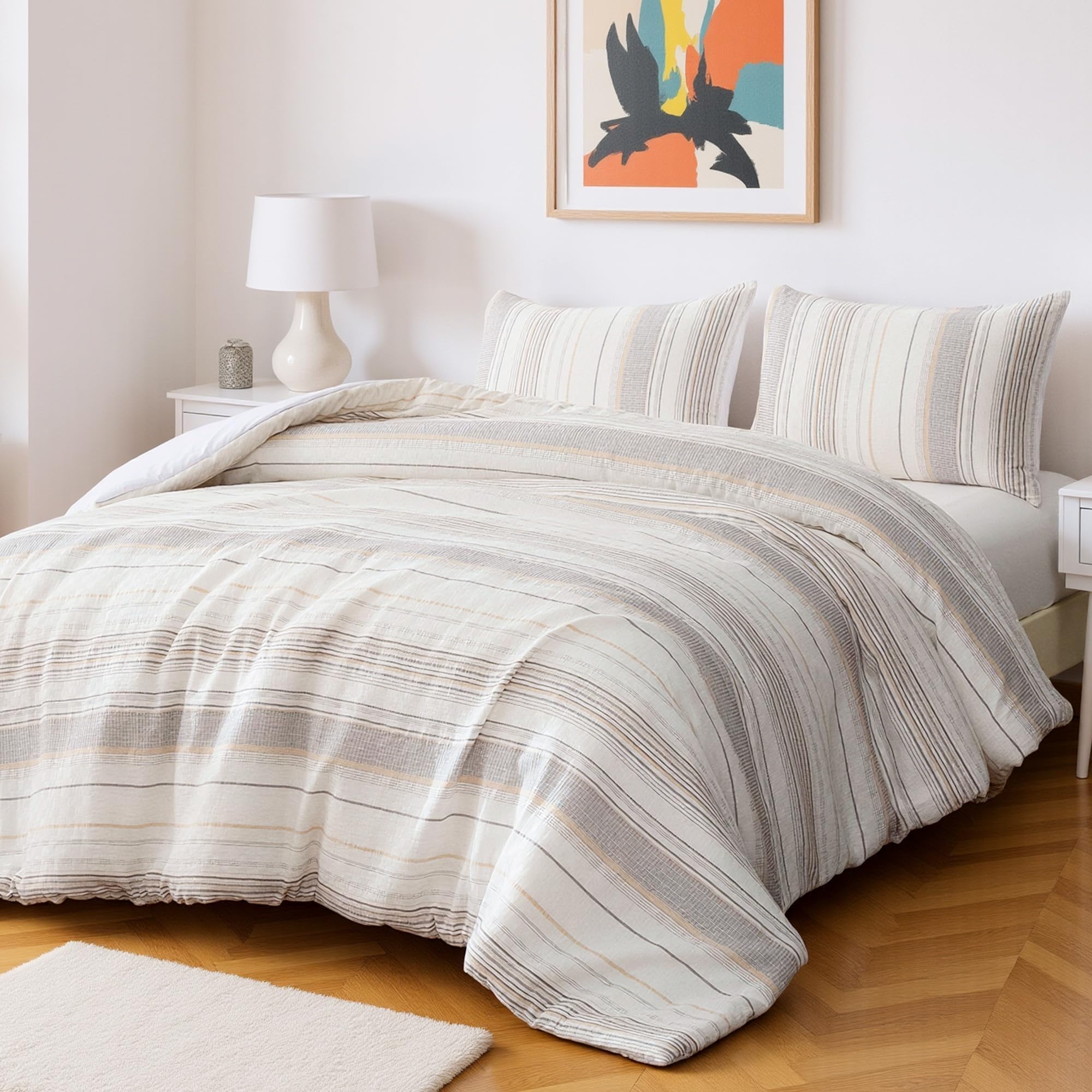 Amazon Basics comforter set close-up beige stripes showing plush microfiber texture.