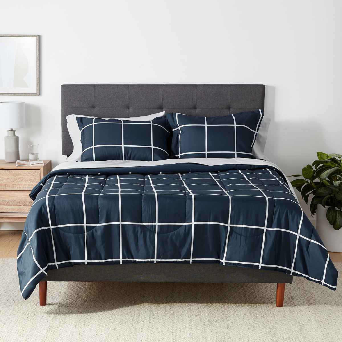 Amazon Basics comforter set on bed in navy and grey plaid, soft microfiber