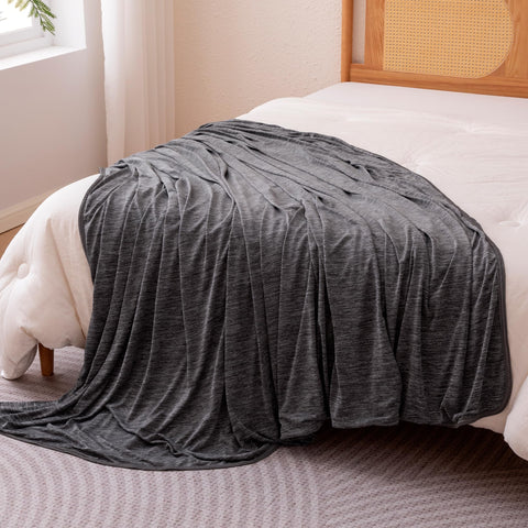 Amazon Basics cooling blanket with reversible lightweight design for bed or couch.