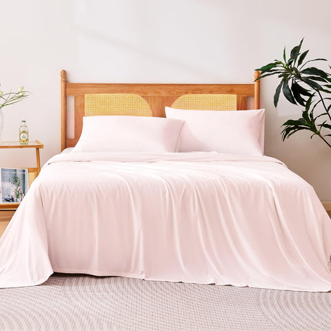 Amazon Basics cooling sheets queen pink on bed flat lay shows breathable fabric.