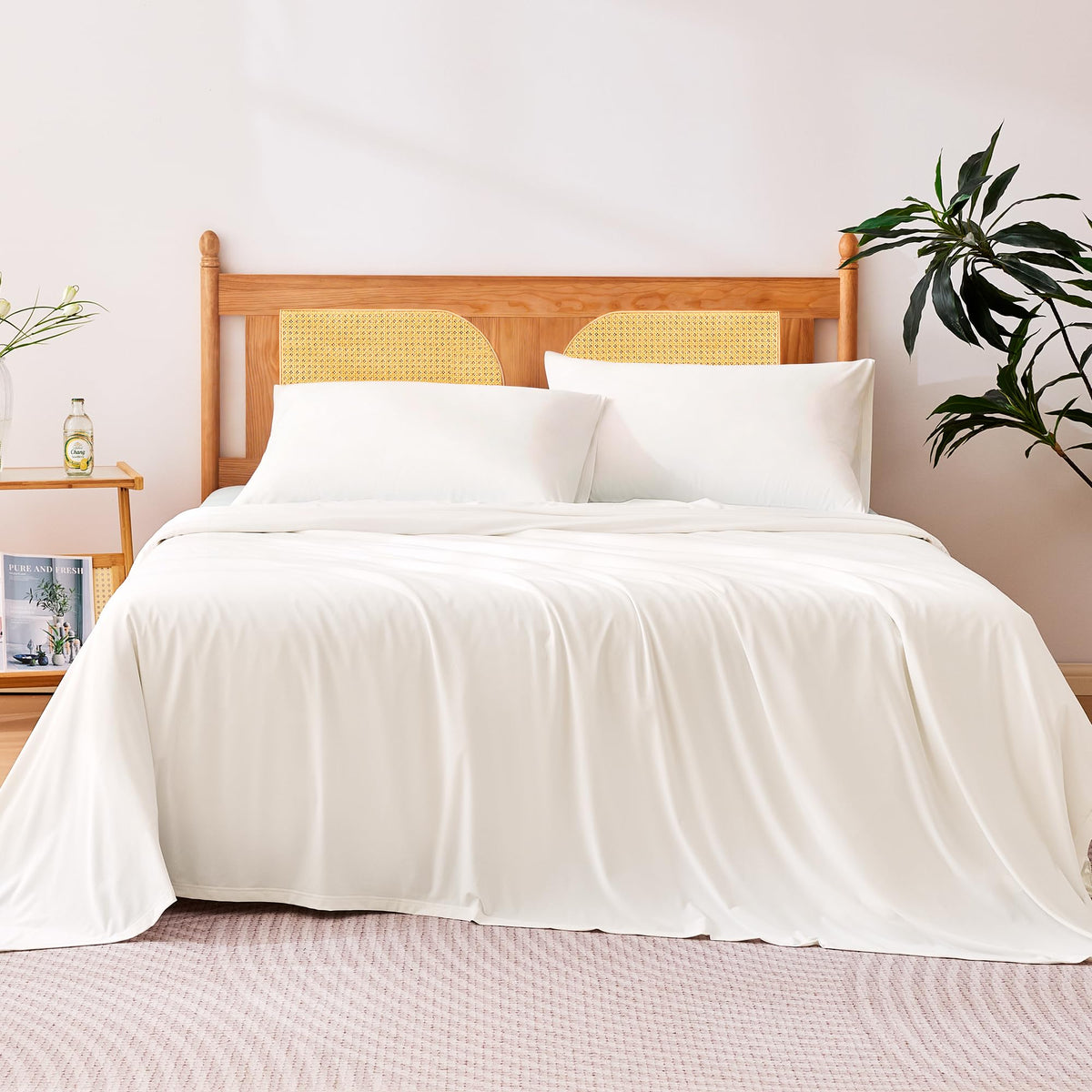 Amazon Basics cooling sheets folded on bed, showcasing the clean white set for hot sleepers.