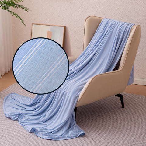 Amazon Basics cooling striped blanket king blue stripe on bed, soft and cool.