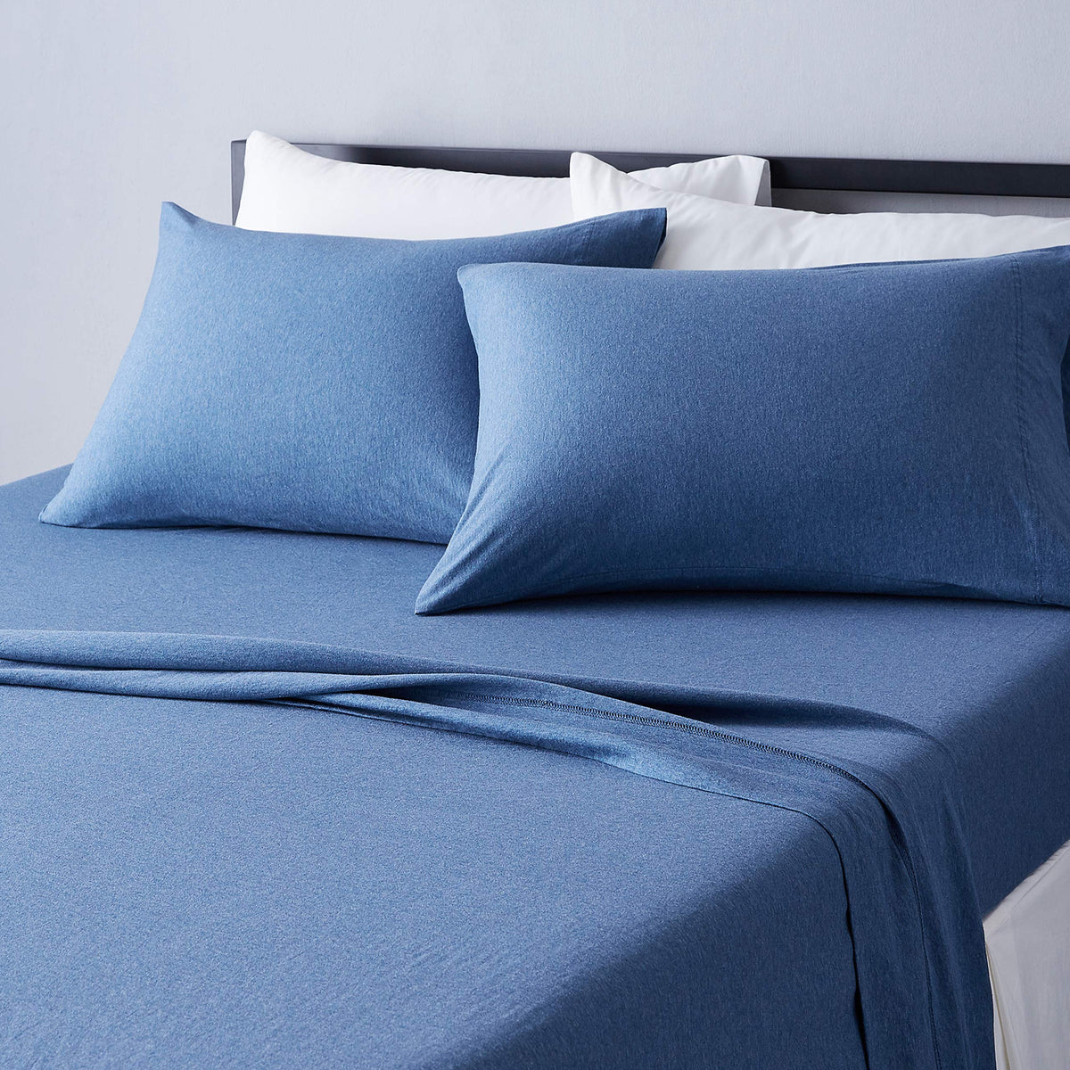 Amazon Basics cotton jersey bed sheet set king chambray blue on bed, soft and breathable.