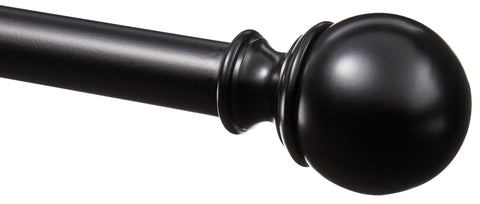 Amazon Basics curtain rod with round finials in black, extended to fit wide windows.