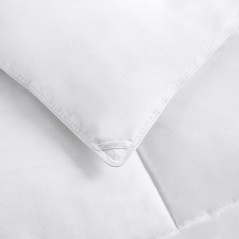 Amazon Basics full queen white comforter laid flat showing soft microfiber shell for all season warmth.