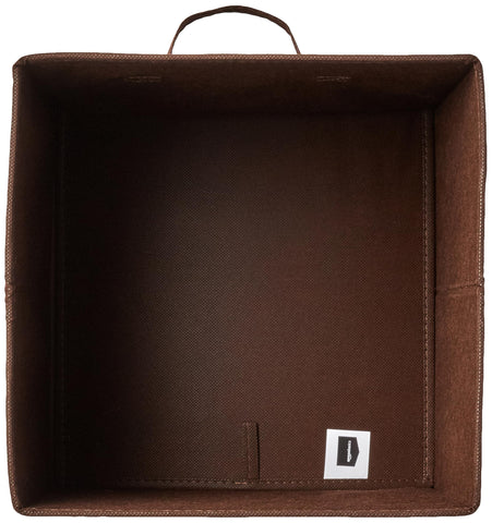 Amazon Basics cube storage bin folded flat for compact storage.