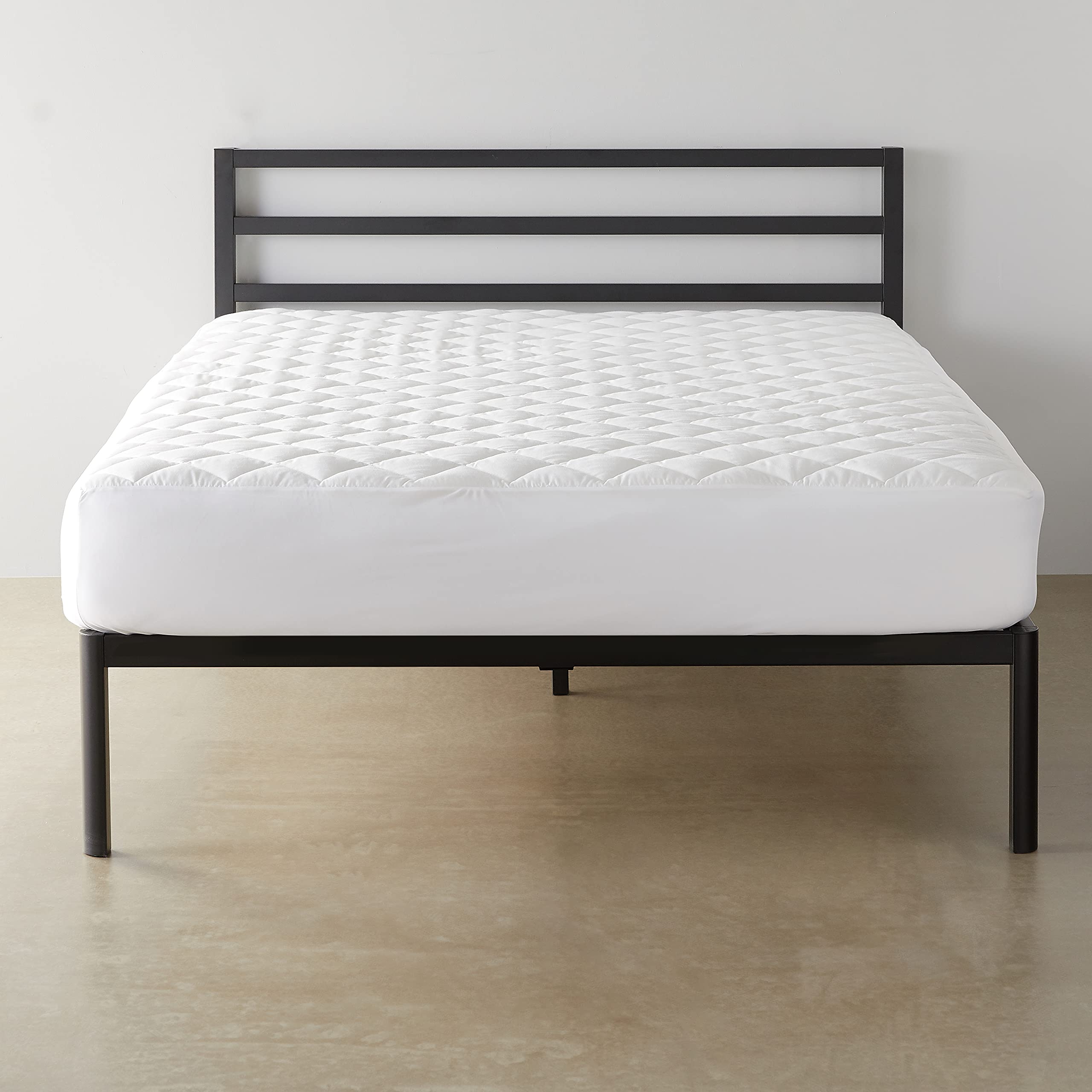 Amazon Basics hypoallergenic quilted topper cover for king beds adds comfort and protection.
