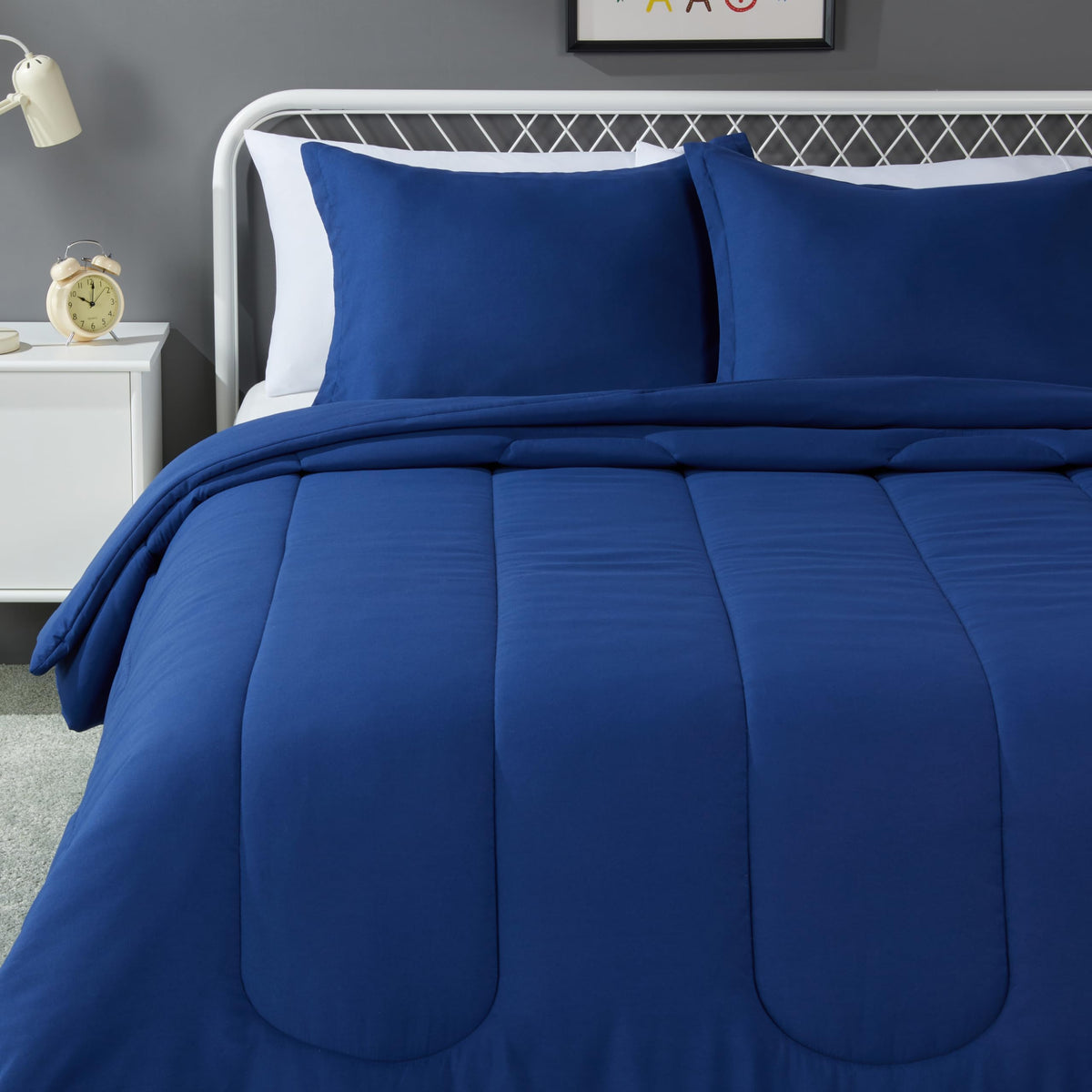 Amazon Basics kids comforter in navy full-queen on bed for a cozy night's sleep