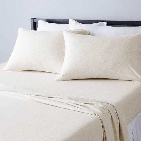 Amazon Basics king sheets oatmeal fitted close-up showing secure fit for deep mattresses.