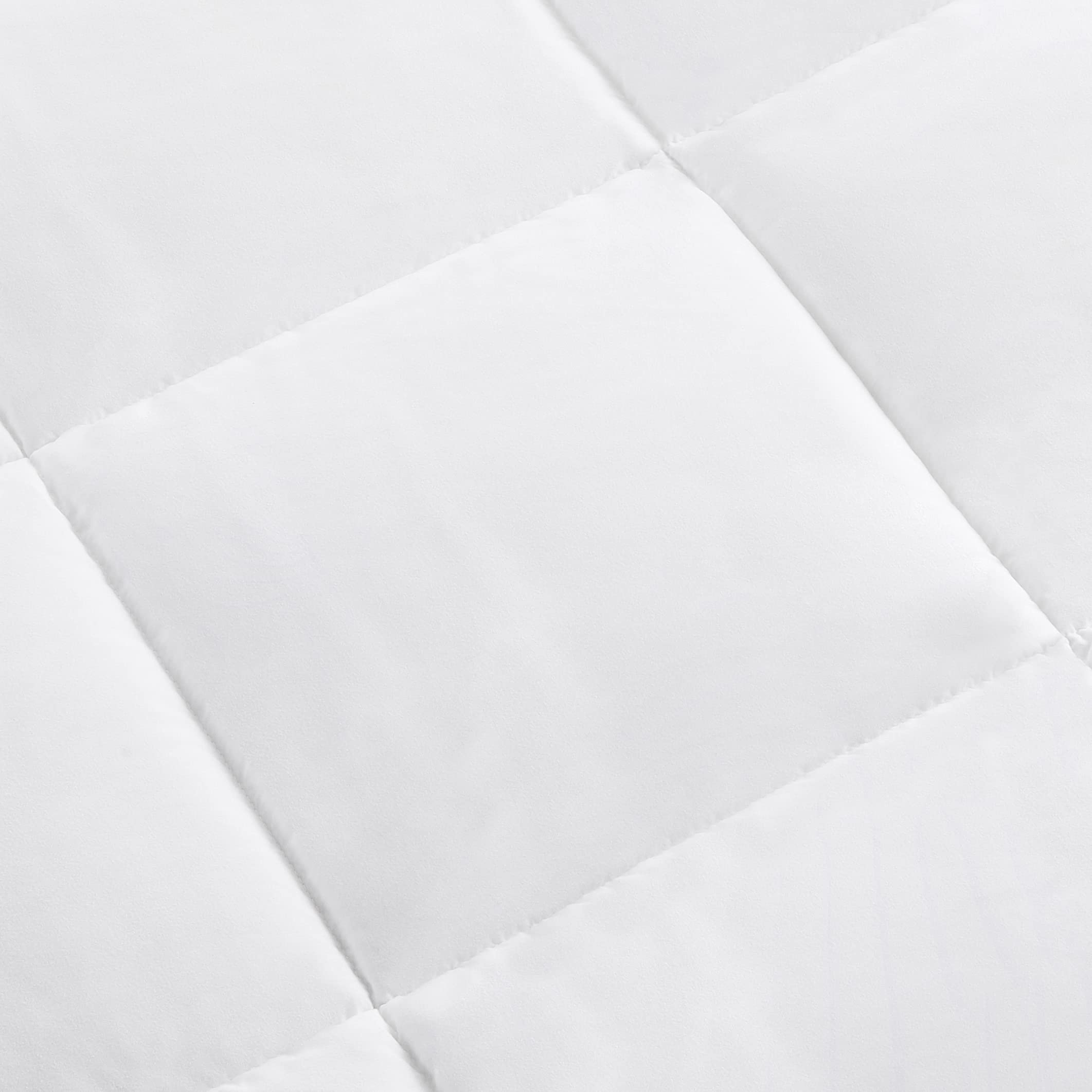 Amazon Basics machine washable comforter shown for easy home cleaning and care.