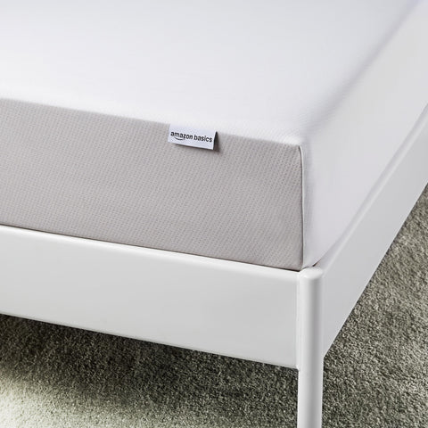 Amazon Basics memory foam mattress twin highlighting the durable bottom layer for support.