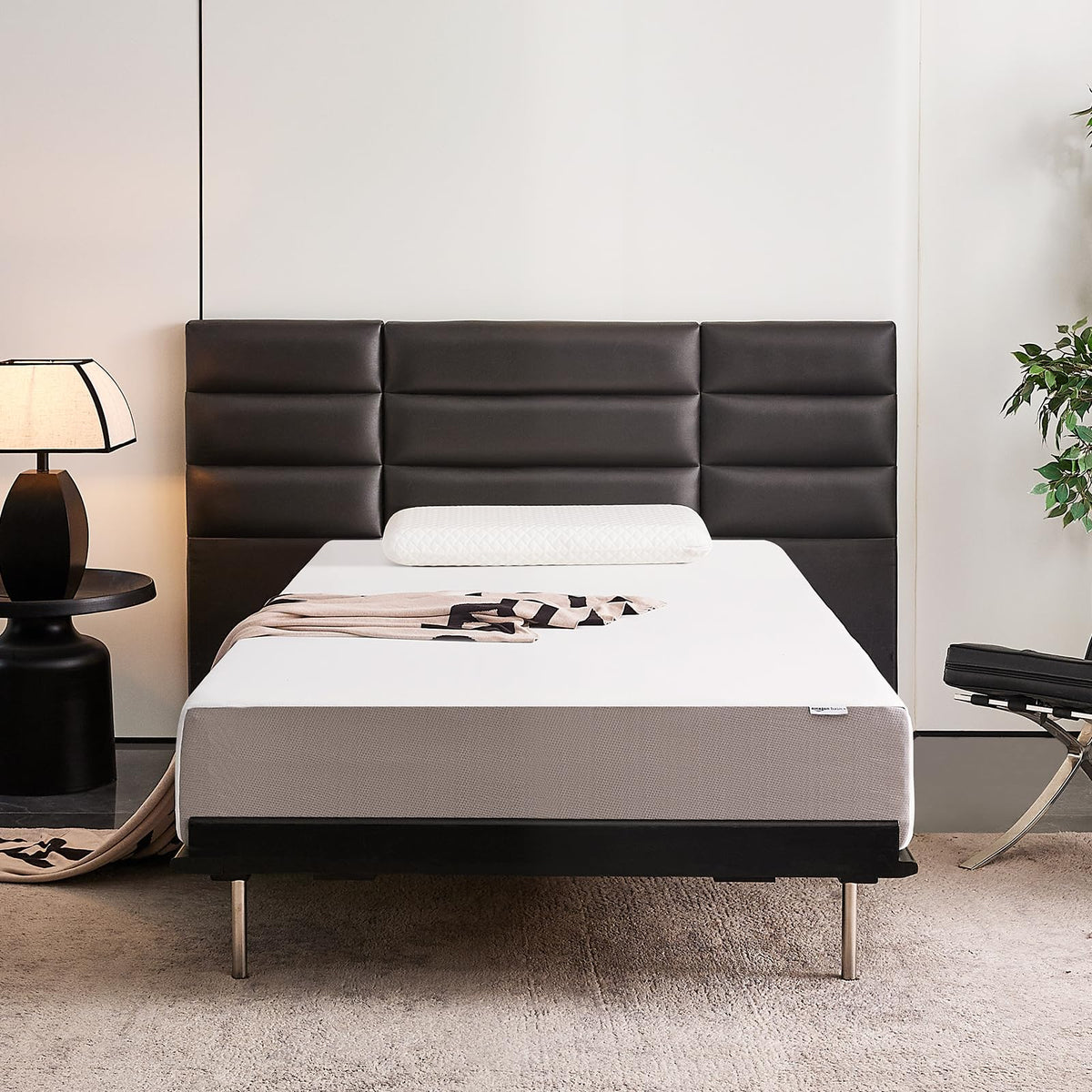 Amazon Basics memory foam mattress plush-top offers cozy guest room comfort.