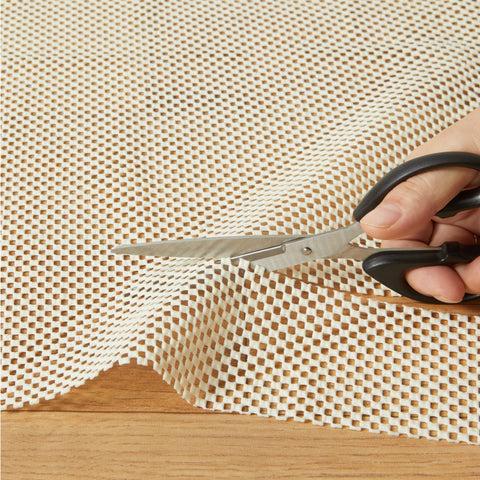 Amazon Basics rug pad 8x10, durable core provides long-lasting support.