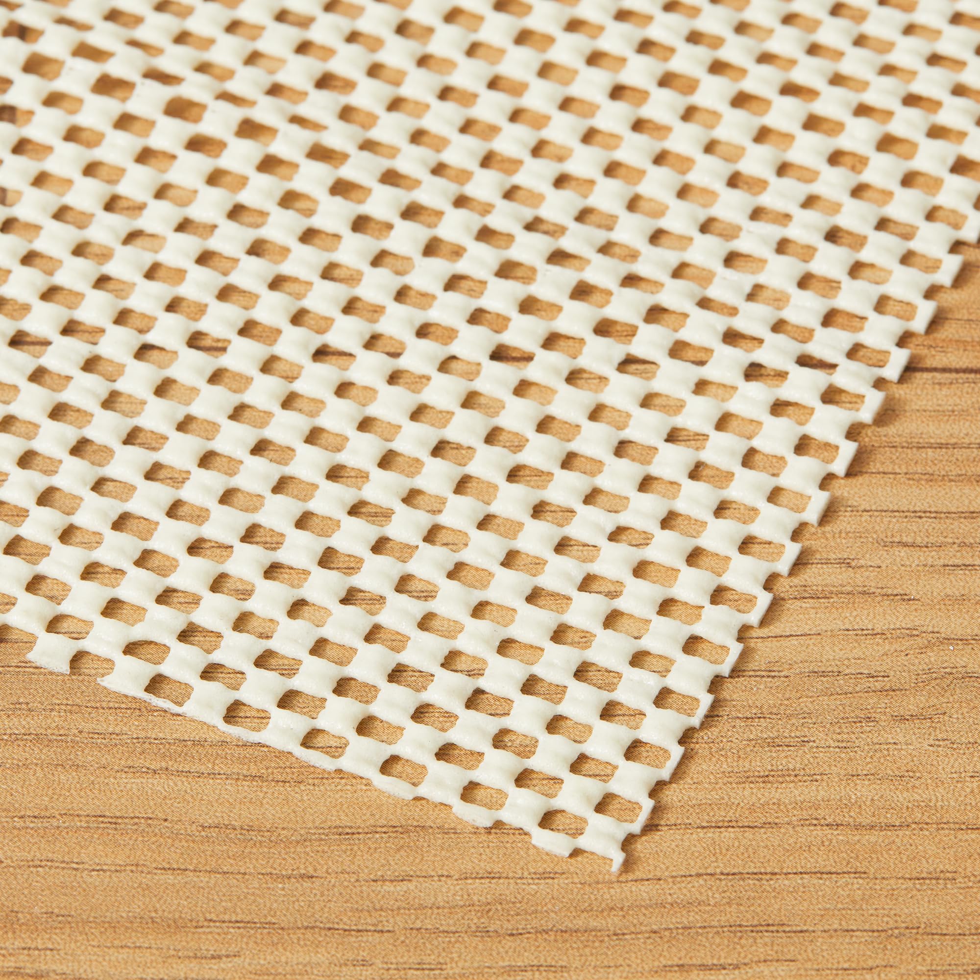 Amazon Basics non-slip rug pad under rug image illustrates stable placement.