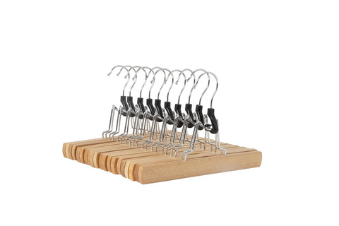 Amazon Basics wooden pants hangers in natural finish keep trousers neatly organized.