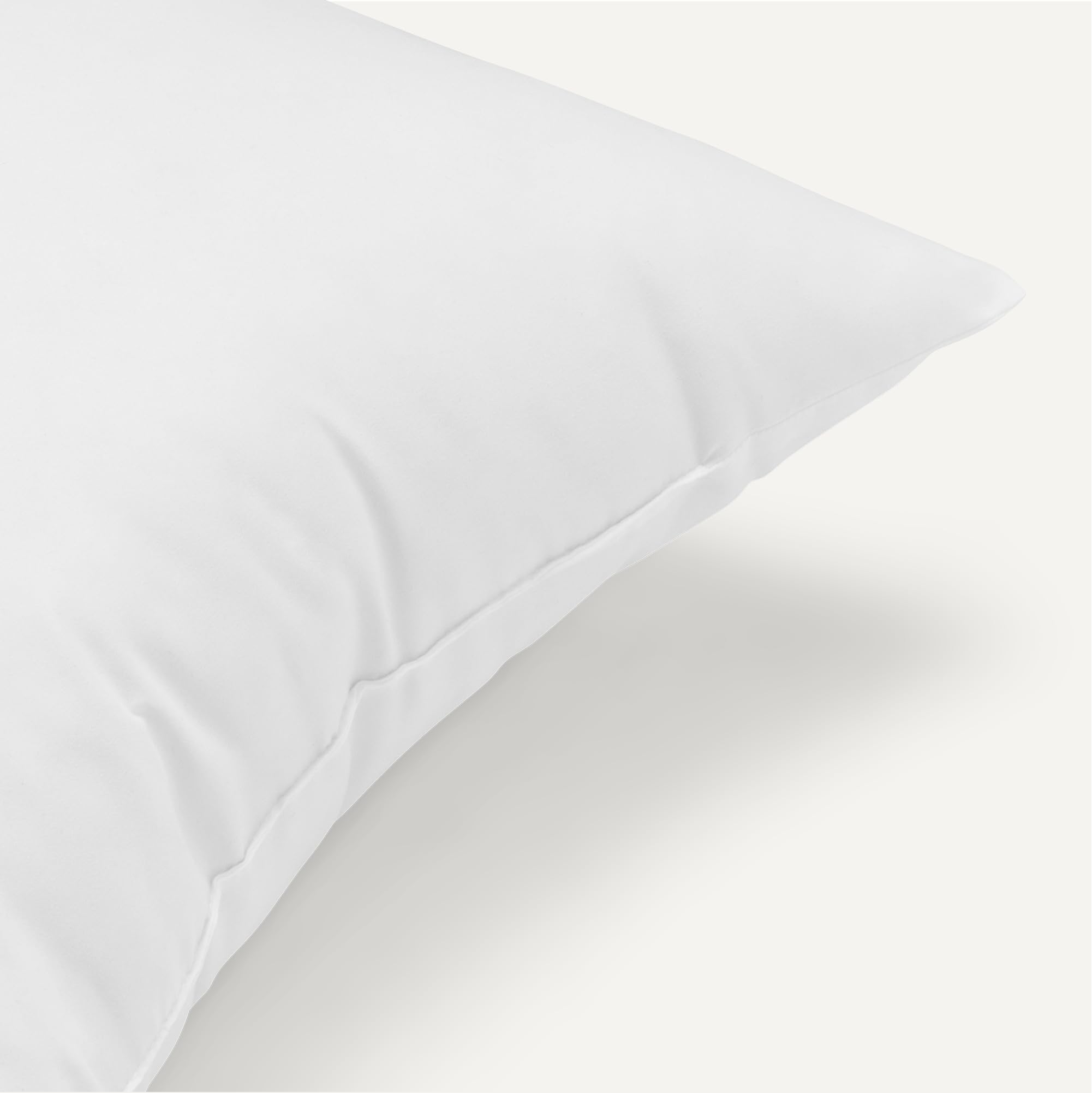 Amazon Basics pillow insert arrives compressed and puffs up for fresh-looking cushions.