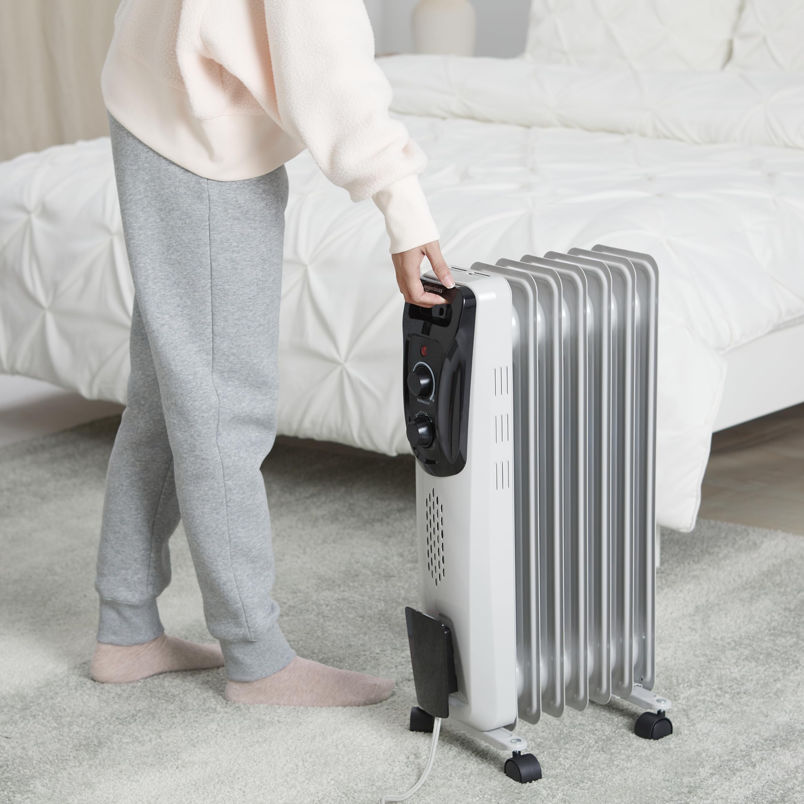 Amazon Basics vertical oil radiator heater, slim profile for tight spaces.