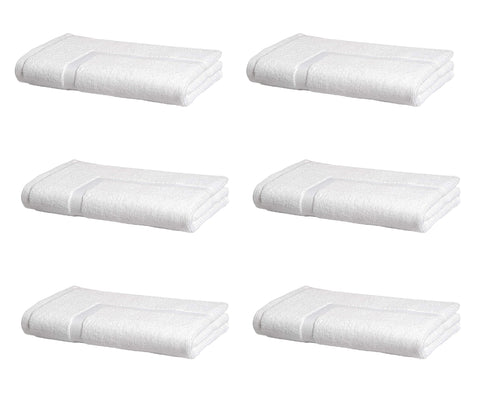 Amazon Basics premium cotton bath mat 20x30 in white, soft and highly absorbent for guest bathrooms.