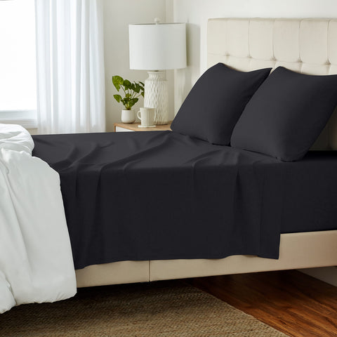 Amazon Basics queen jersey bed sheet set on bed, soft and breathable.