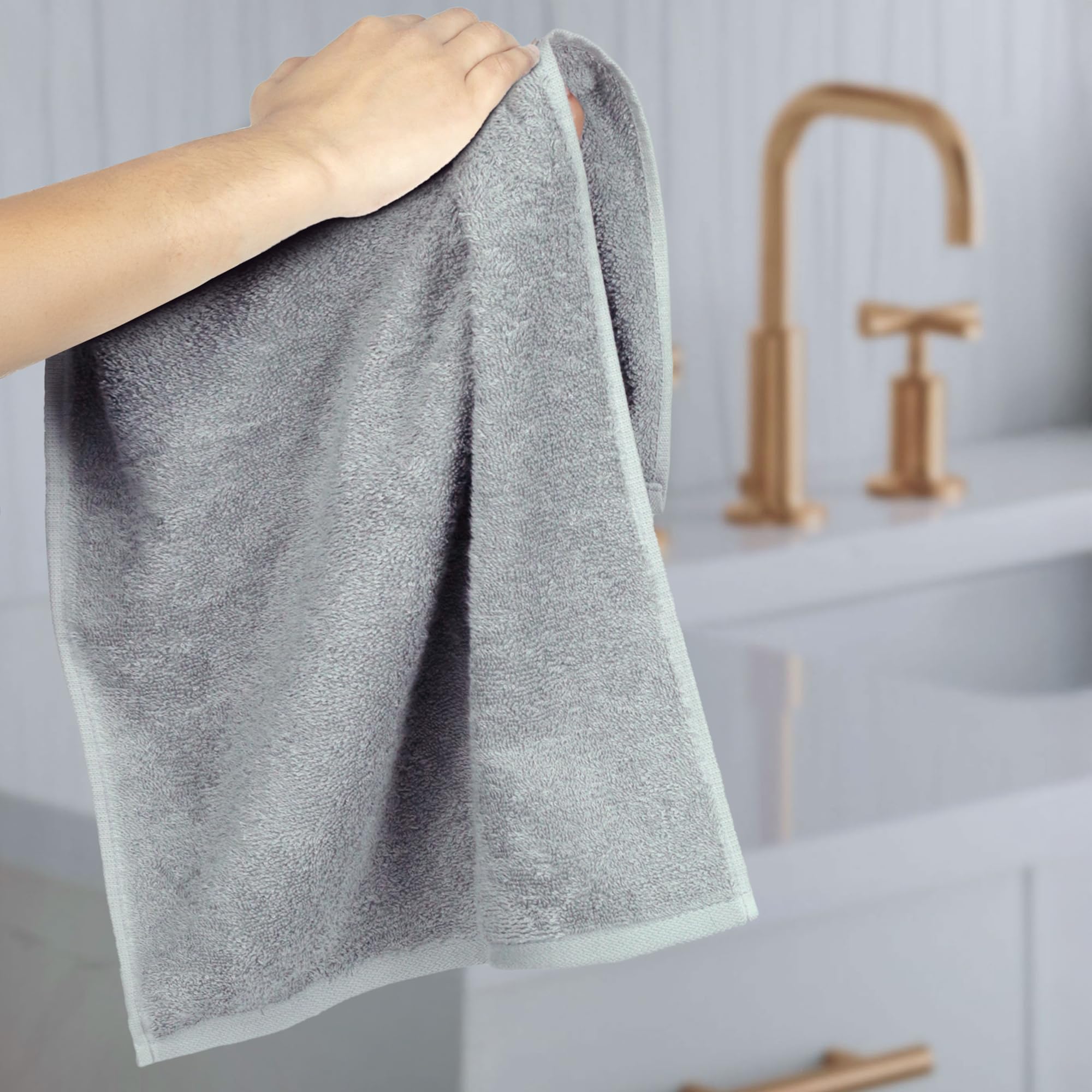 Amazon Basics reinforced-edges gray towel resists unraveling after washes