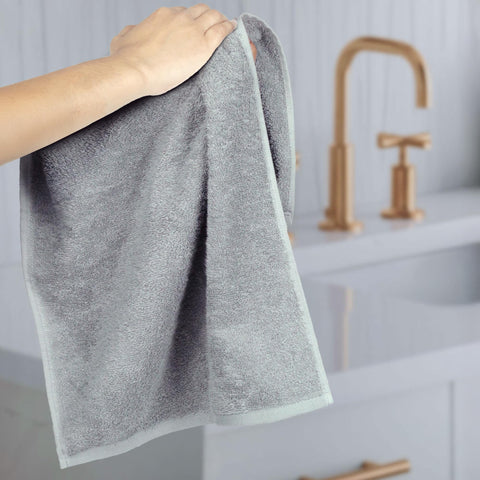 Amazon Basics reinforced-edges gray towel resists unraveling after washes