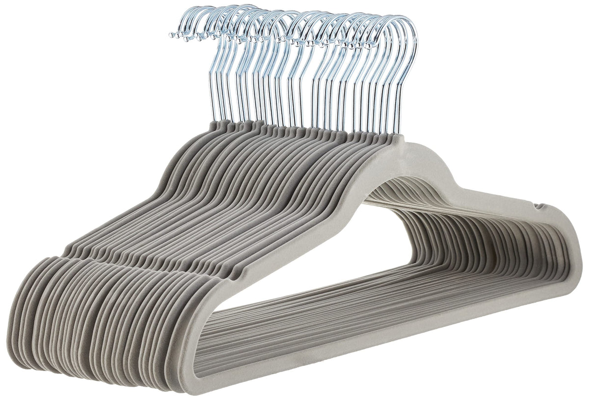 Amazon Basics slim velvet hangers boxed in grey for organized closet storage.