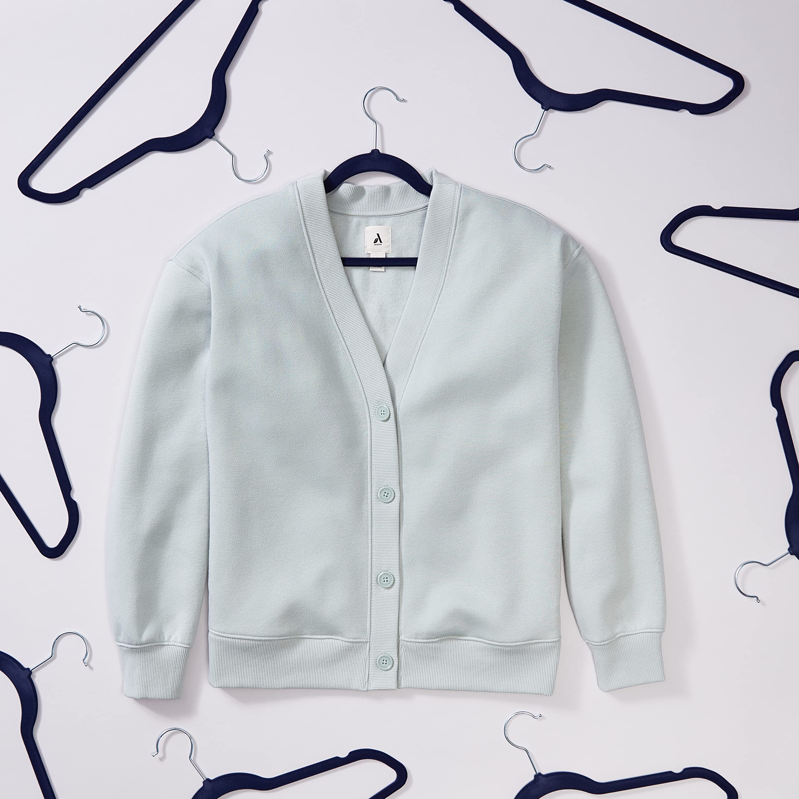 Amazon Basics navy and silver hangers in closet setting for space saving