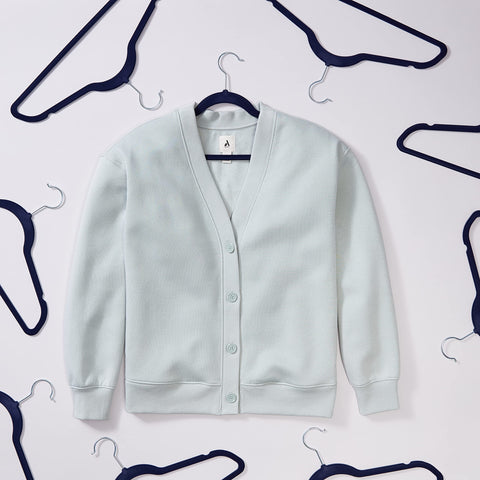 Amazon Basics navy and silver hangers in closet setting for space saving