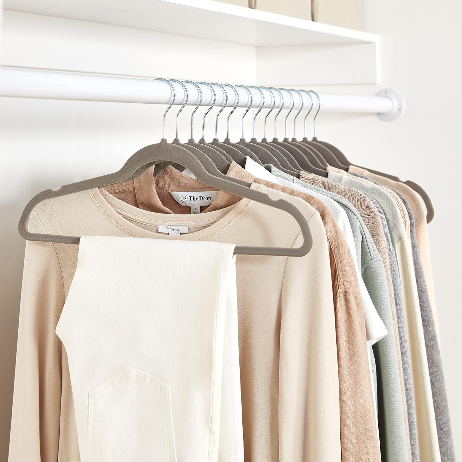 Notched shoulders on Amazon Basics velvet hangers secure garments.
