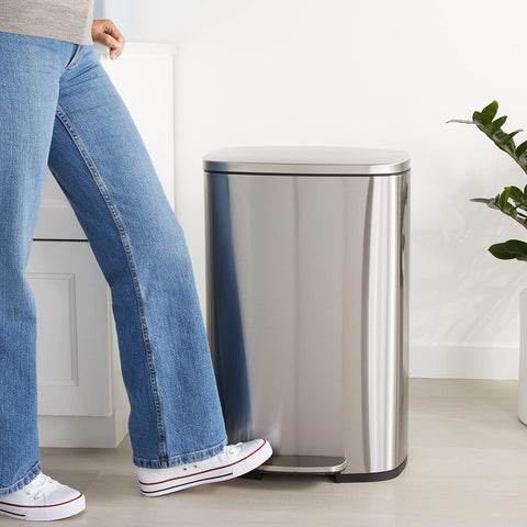Amazon Basics trash can foot pedal enabling hands-free disposal