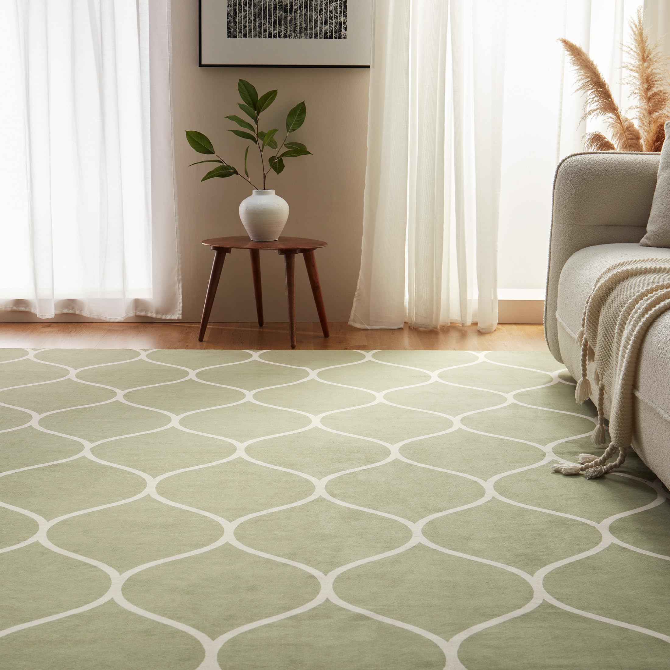 Close-up of geometric pattern on Amazon Basics rug in green