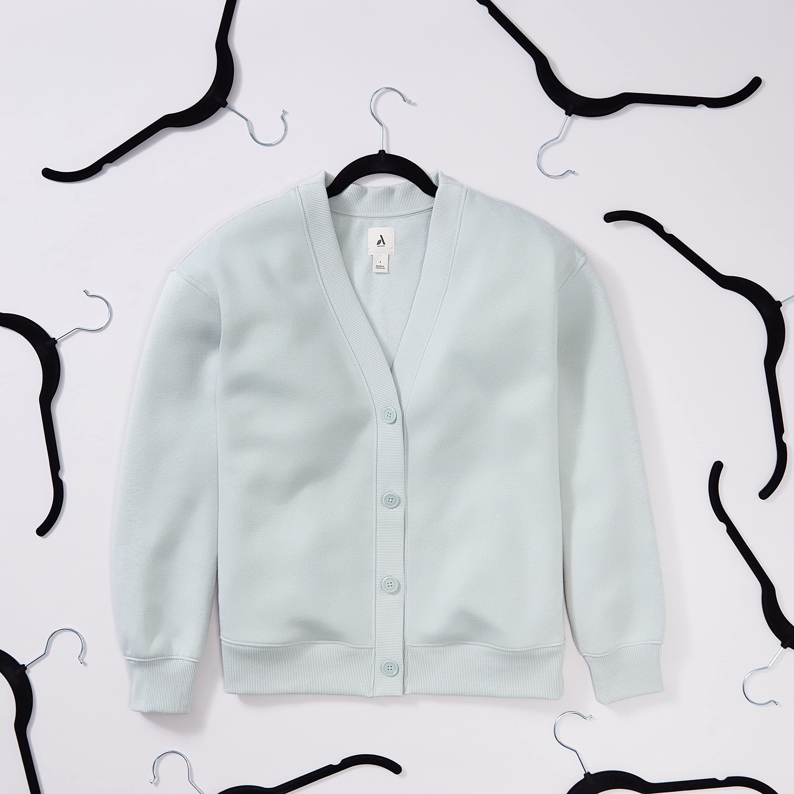 Amazon Basics velvet hangers with non-slip shoulders prevent slips and maintain garment shape.