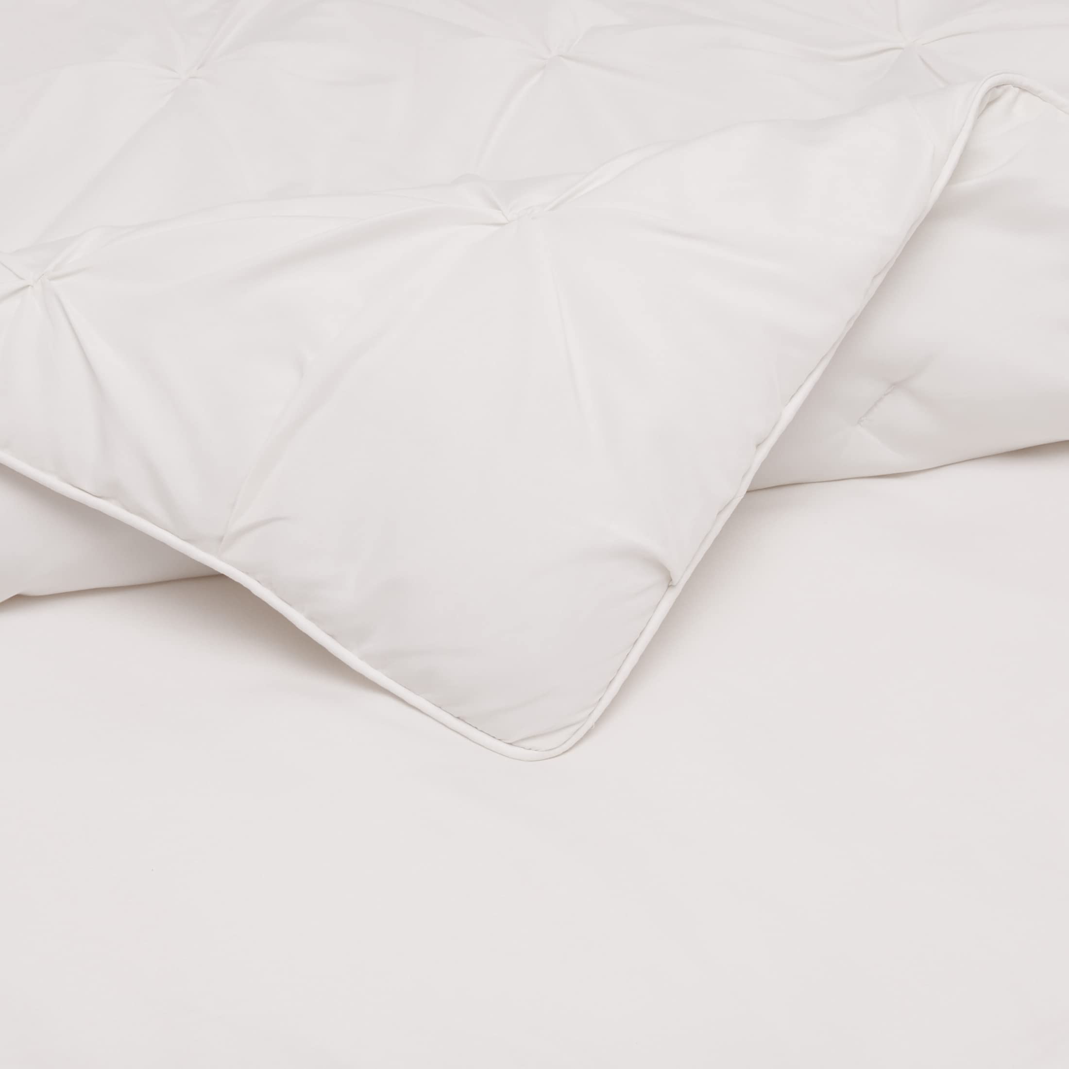 Bed setup with Amazon Basics full/queen comforter set for versatile styling.