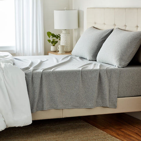 Amazon Basics 4-piece sheet set in light gray, front view shows breathable cotton jersey.