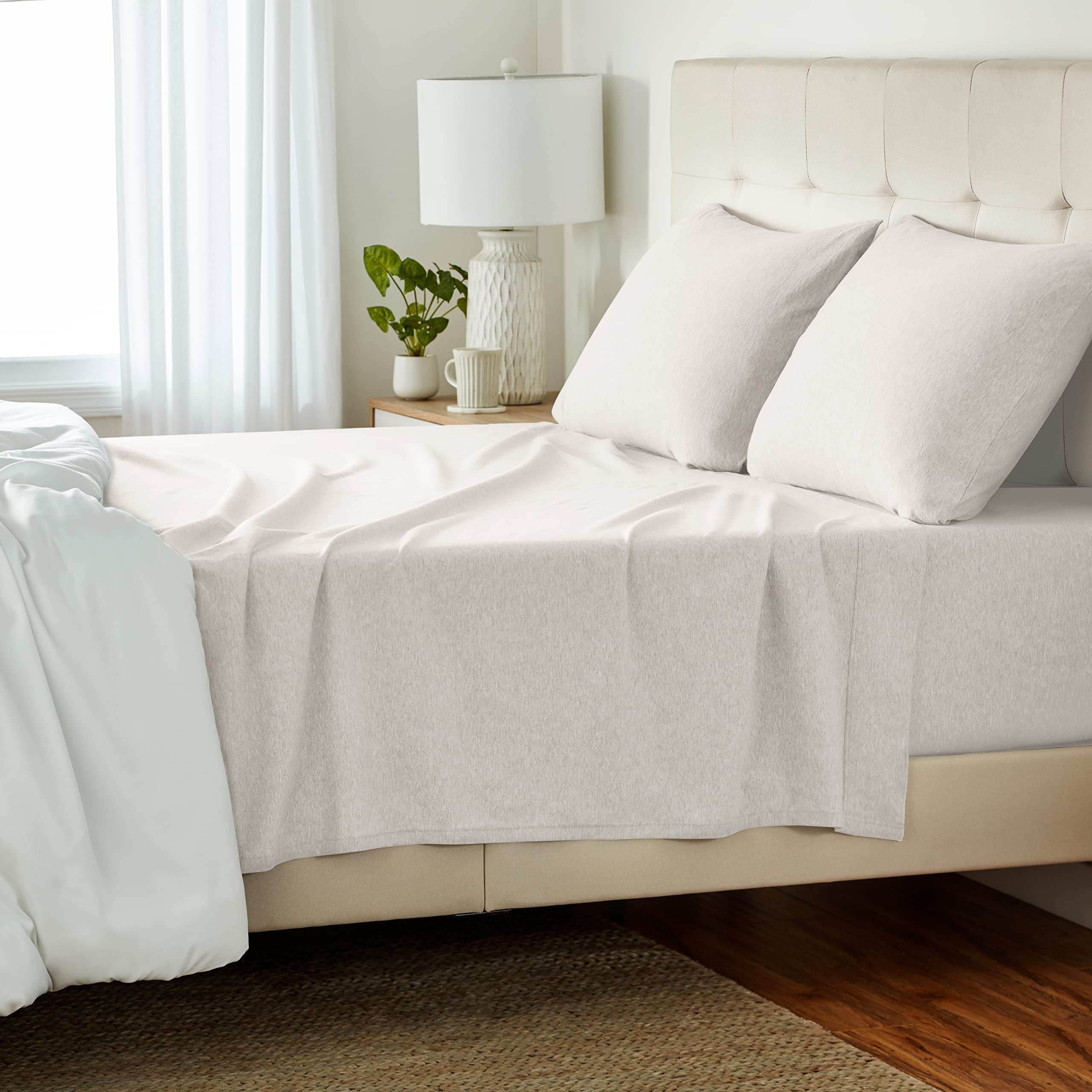Amazon Basics cotton jersey flat sheet for queen size offers breathable comfort and secure fit.