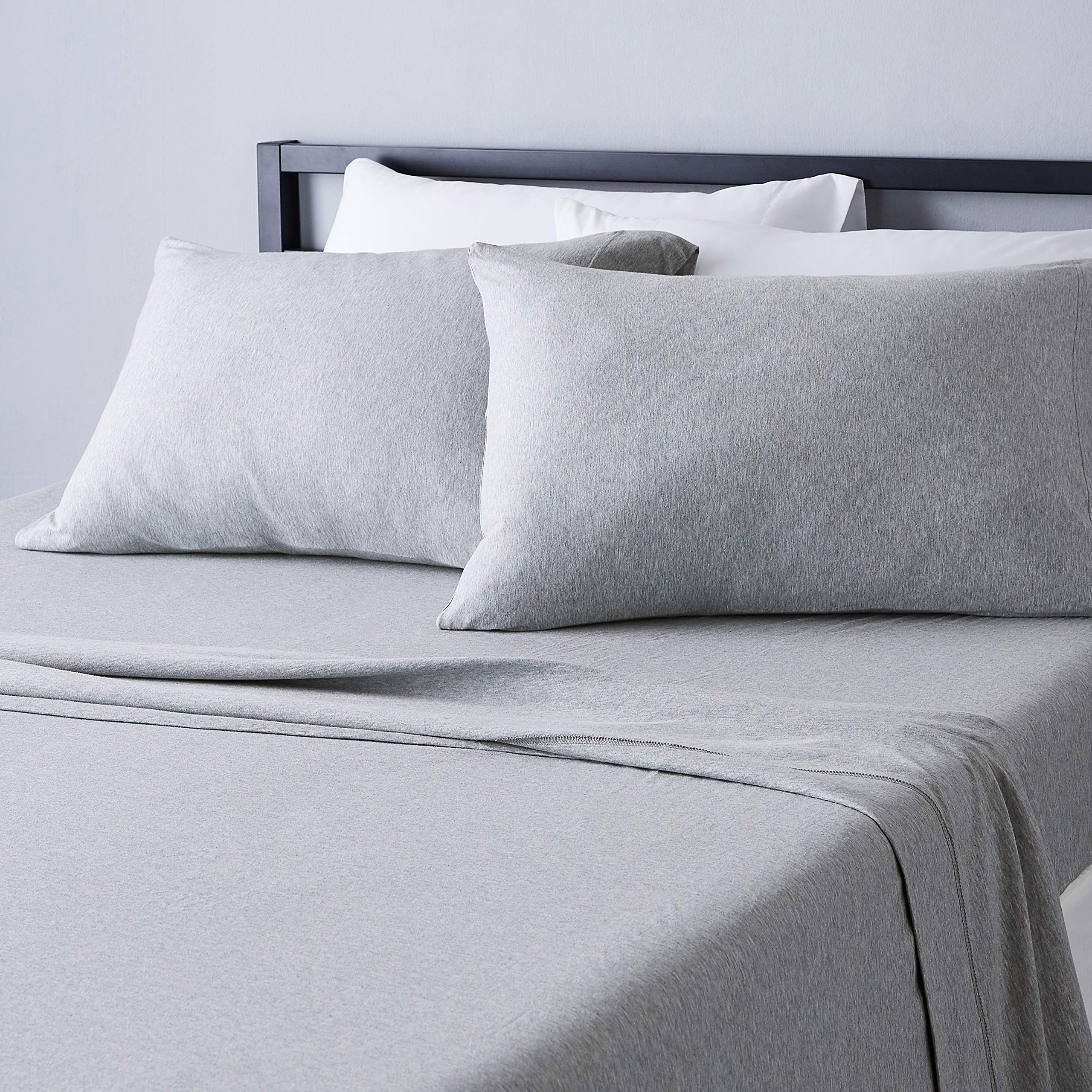 Amazon Basics cotton jersey king sheet close-up shows soft, breathable fabric.