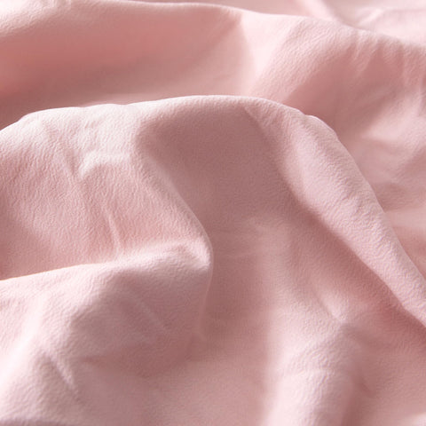 Amazon Basics Kids' Pink Bedding Set tufted jacquard design adds playful texture.