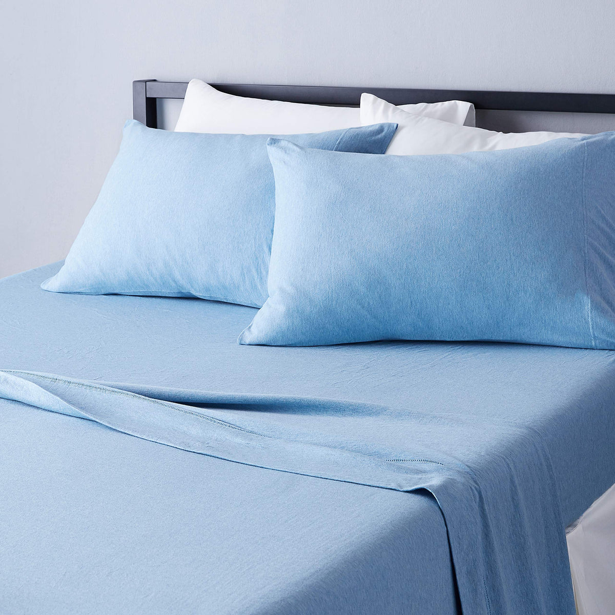 Amazon Basics king cotton jersey fitted sheet on mattress offers secure fit.
