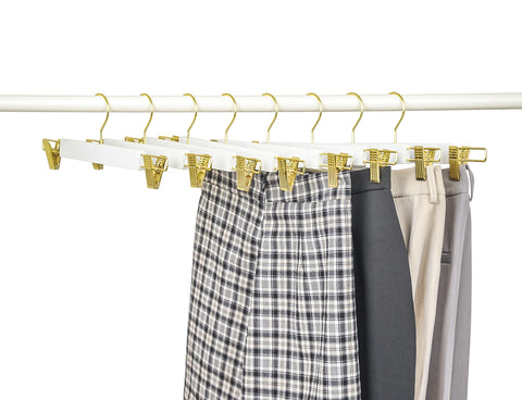 Amber Home gold-accent hangers suit modern bedroom décor.