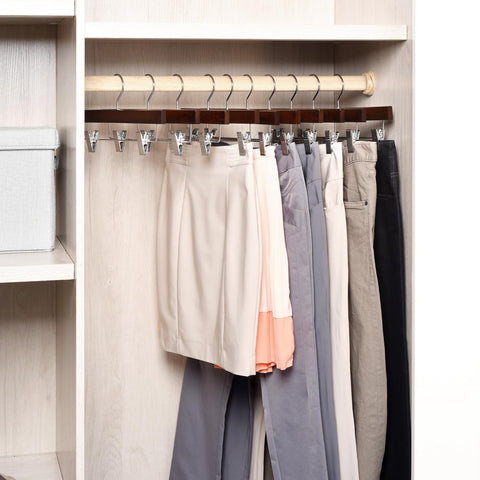 Amber Home 14-inch wood hangers support long garments with secure clips.
