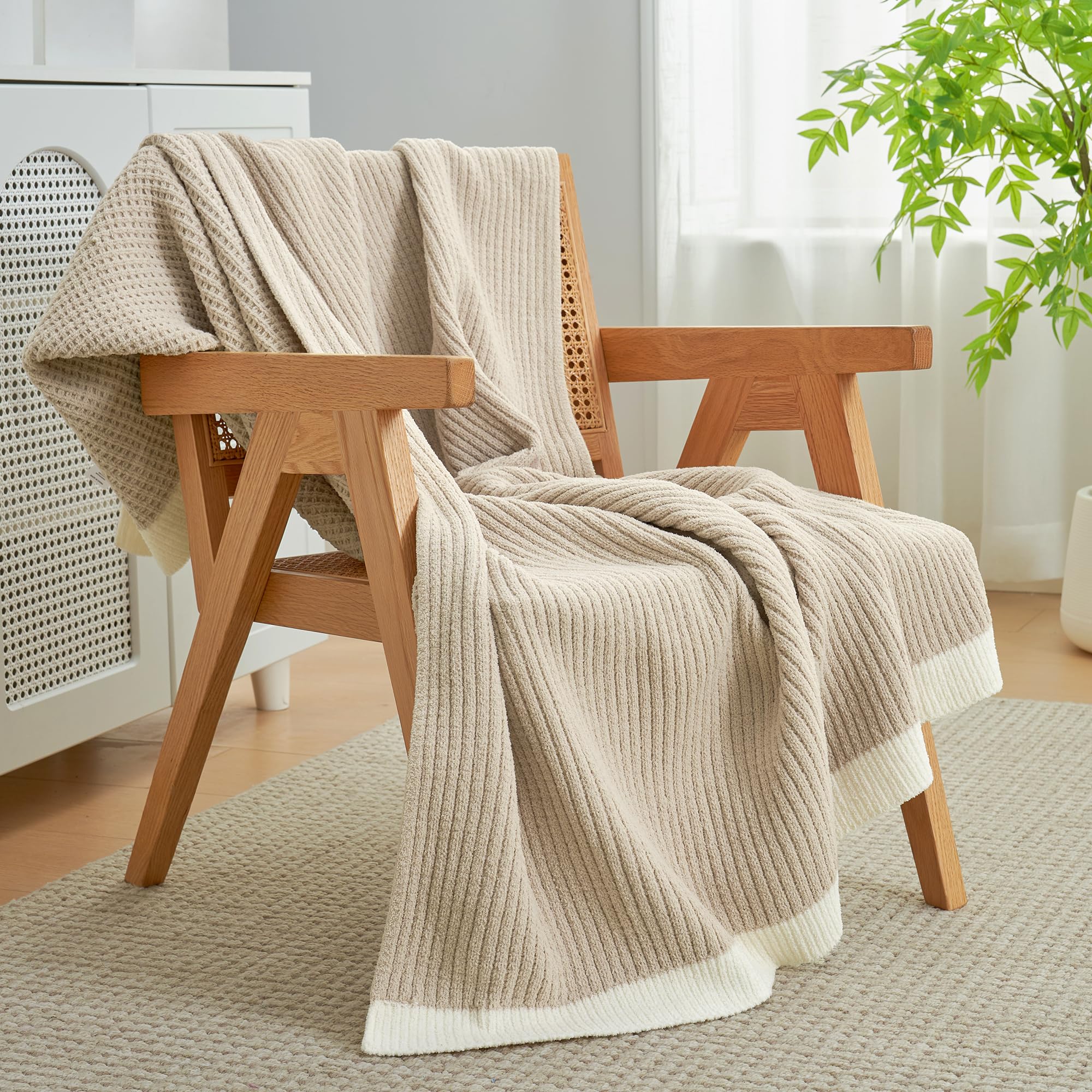 Amélie Home chenille throw in a bedroom creates soft inviting ambience.