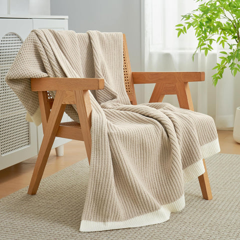 Amélie Home chenille throw in a bedroom creates soft inviting ambience.