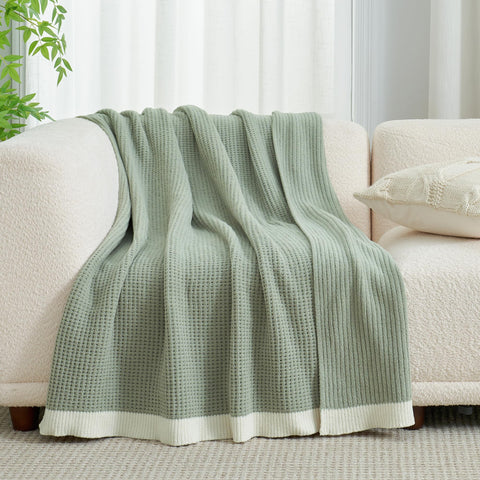 Amélie Home chenille waffle throw ready for machine washing on gentle cycle.