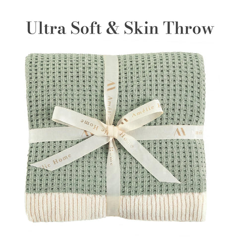 Amélie Home chenille waffle throw shows reversible texture for versatile decor in any room.