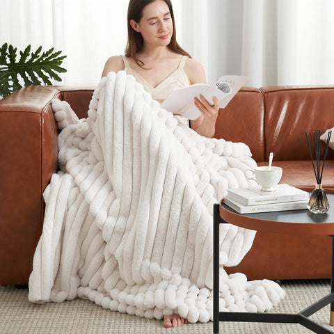 Amélie Home dual-sided plush blanket close-up shows luxe texture and warmth.