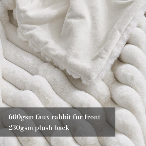 Amélie Home faux fur throw with jacquard stripe enhances living room ambiance.