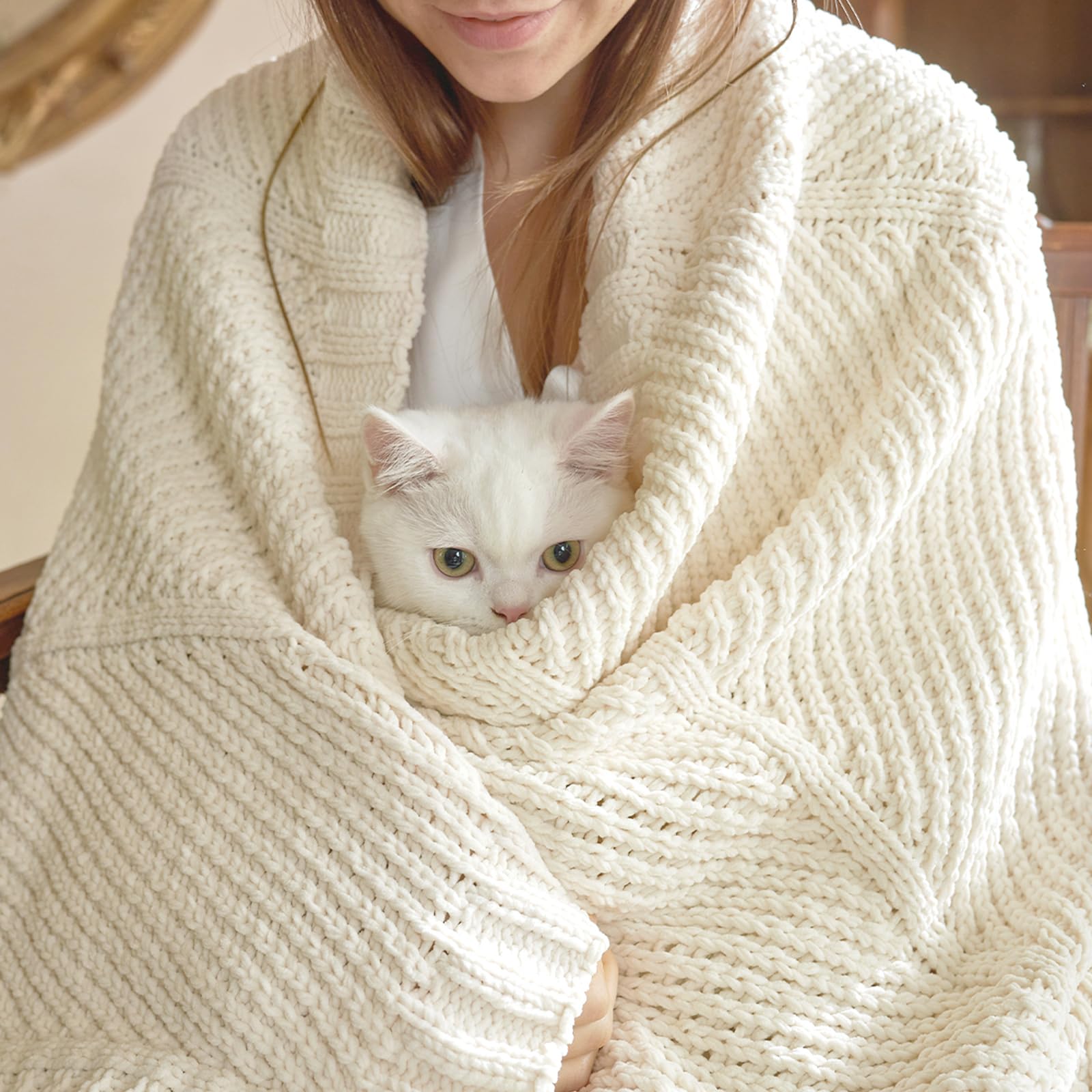 Amélie Home knit throw blanket chevron-pattern-texture enhances living room depth and style.