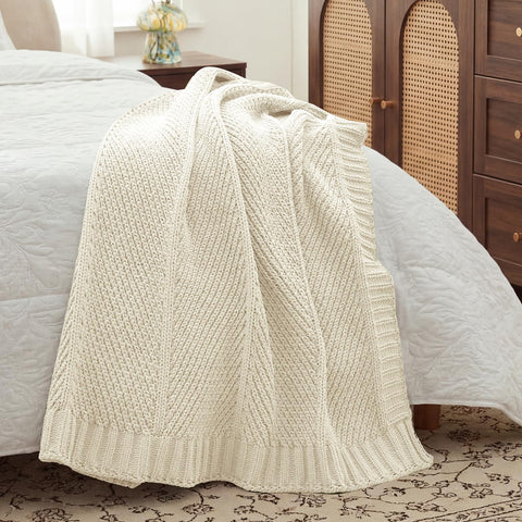 Amélie Home knit throw blanket ivory-color complements neutral palettes beautifully.