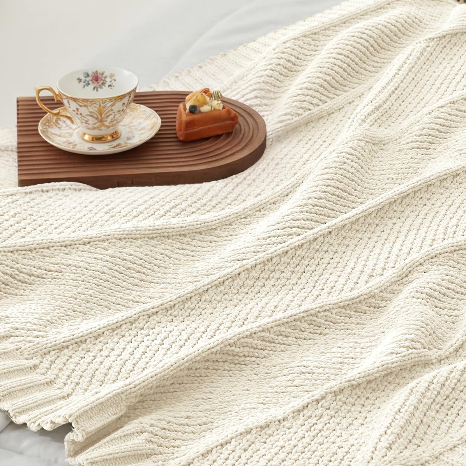 Amélie Home knit throw blanket versatile-decor adapts from couch to bed with ease.